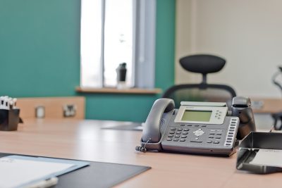 close up of desk phone at manchester east serviced office